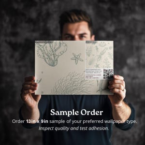 May include: A sample order of wallpaper featuring a sea life design. The sample is 13 inches by 9 inches. The text on the sample reads "Sample Order" and "Order 13in x 9in sample of your preferred wallpaper type. Inspect quality and test adhesion."
