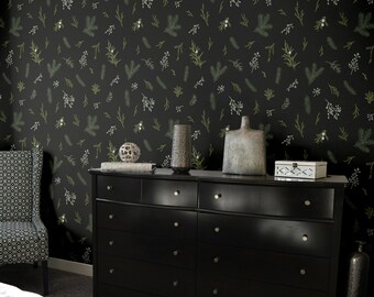 Puede incluir: Un dormitorio con una cómoda negra, un sillón estampado y una pared oscura adornada con un estampado botánico de ramitas verdes y blancas. Jarrones decorativos y una pequeña caja sobre la cómoda.