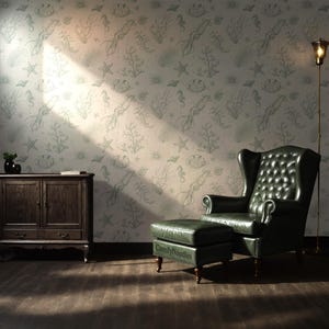 May include: A living room with a green leather armchair and ottoman in front of a wall with a light green and white wallpaper featuring a repeating pattern of sea creatures, including squid, seahorses, and starfish.