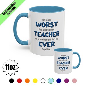 May include: White ceramic mug with a blue interior and handle. The mug features the text "Even on your WORST days, you are a great TEACHER and an amazing friend. Don't you EVER forget that." A smaller version of the mug is also visible.