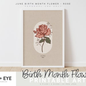 May include: Printable art print featuring a pink rose with green leaves and stems. The rose is in a circle with the word "June" and "Love" written below it. The print has a beige background and a white frame.
