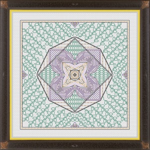 May include: A geometric pattern with a purple, green, and gold design on a white background. The pattern is framed in a brown frame with a yellow mat.