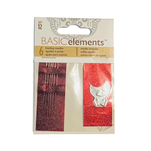May include: A package of Basic Elements beading needles and a needle threader. The package has a white and gold header with the number 12. The needles and threader are on a red, glittery background. The package includes 6 beading needles and 1 needle threader.