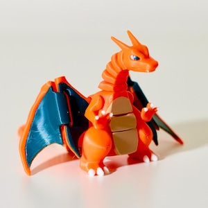 Glurak: Posierbares Taschenmonster