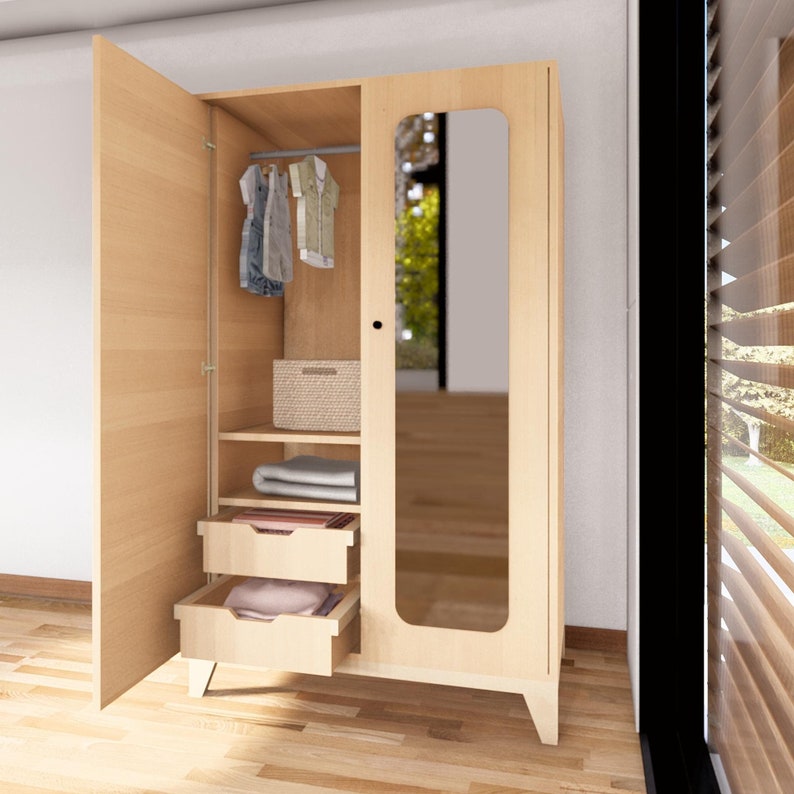 May include: A light wood wardrobe with a mirrored door and two drawers. The wardrobe has a shelf and a hanging rod inside.
