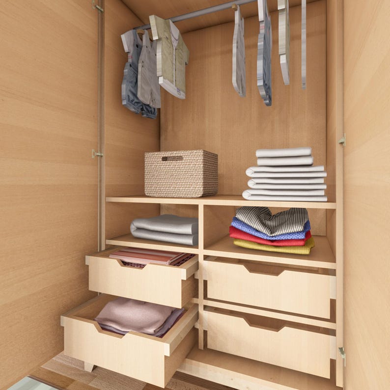 May include: A wooden closet with a shelf and drawers. The shelf has a wicker basket and folded clothes. The drawers are open and contain folded clothes. There are clothes hangers with clothes hanging on them.