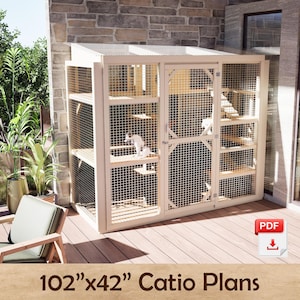 May include: A light-coloured wooden cat enclosure featuring a wire mesh exterior, a slanted roof, and multiple internal platforms for climbing. The structure includes a central door and is labelled as 102"x42" Catio Plans with a PDF download icon.