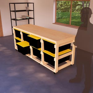 May include: A wooden workbench with black and yellow storage bins on wheels. The workbench has a wooden top and a frame made of wood.