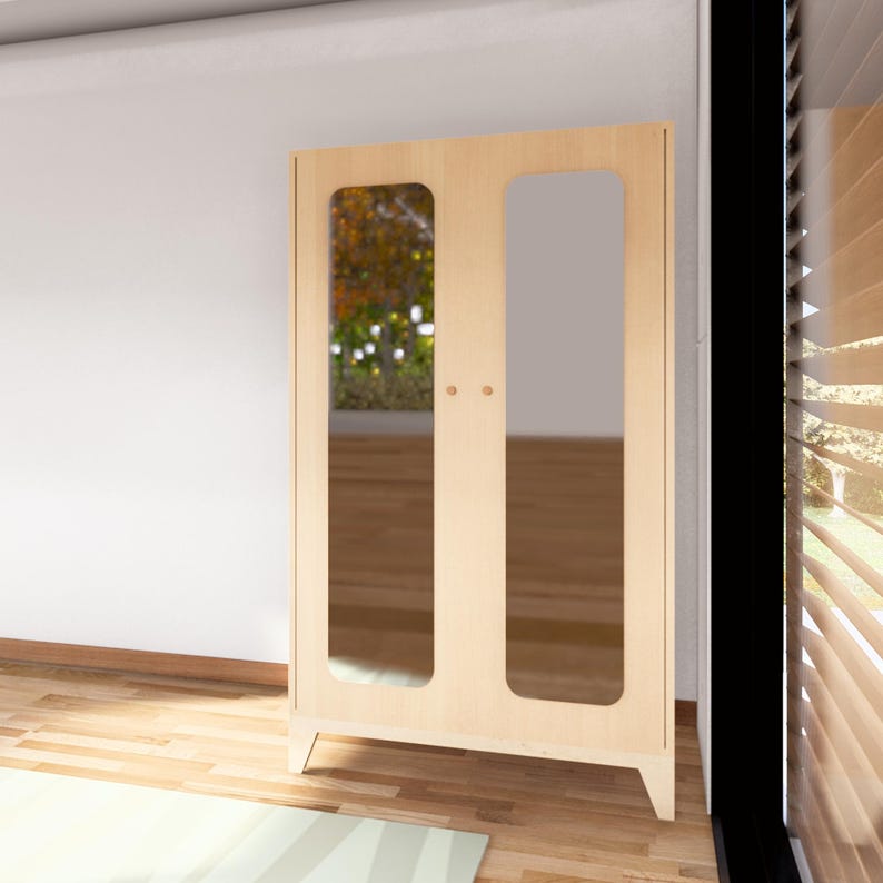 May include: A light wood cabinet with two doors and mirrored panels. The cabinet has a simple, modern design and is ideal for storing clothes or other items.