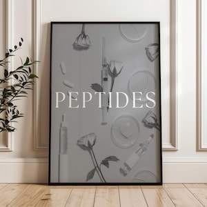 May include: A framed grayscale print featuring the word "PEPTIDES" in white capital letters. The image includes syringes, capsules, eye patches, and roses, suggesting a theme of skincare or medical aesthetics. The artwork is displayed against a light background.