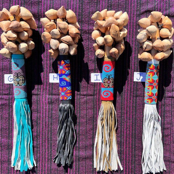 Rattles with beaded leather grip