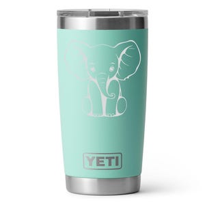 Seafoam Yeti 20oz Rambler Tumbler laser etched with a elephant. The tumbler is a play on a white elephant gift.