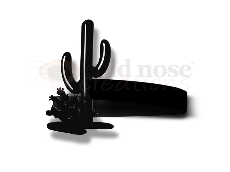 May include: Black silhouette of a tall cactus with smaller cacti at the base. The cactus is a popular desert plant and symbol of the American Southwest.
