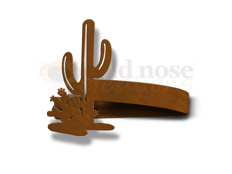 May include: A rustic brown metal napkin ring shaped like a cactus with a single tall cactus and a smaller cluster of cacti. The napkin ring is a decorative accent for a southwestern or desert themed table setting.