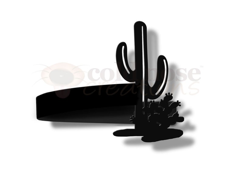 May include: Black metal silhouette of a cactus with a single tall cactus and smaller cacti at the base. The silhouette is mounted on a black metal base.
