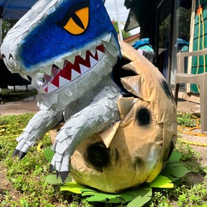 Dinosaur hatching piñata