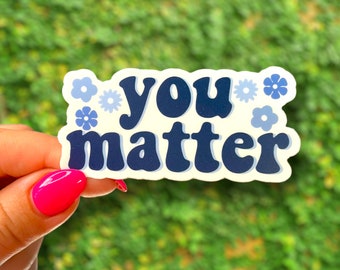 May include: A white sticker with blue flowers and the text "you matter" in a retro font.