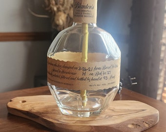 BLANTON'S BOURBON Whiskey Bottle Lamp on an olive wood base.