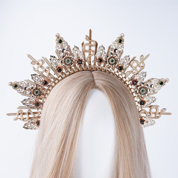 a jeweled headpiece similar to a crown is