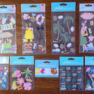 May include: A set of ten sheets of colorful, tropical-themed stickers. The stickers feature palm trees, coconuts, pineapples, flowers, and a tiki hut. The stickers are perfect for adding a touch of Hawaiian flair to your crafts and projects.