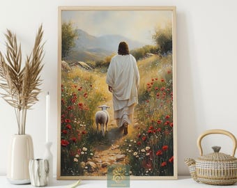 Puede incluir: Una impresión artística enmarcada representa una figura con túnica blanca caminando por un sendero, seguida por un cordero. El sendero está rodeado de flores silvestres, con colinas y luz suave al fondo.