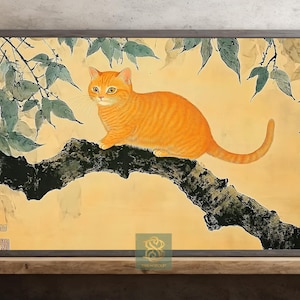 May include: A framed print of a ginger cat perched on a tree branch, rendered in a traditional Japanese style. The artwork features a yellow background, green leaves, and Japanese calligraphy.