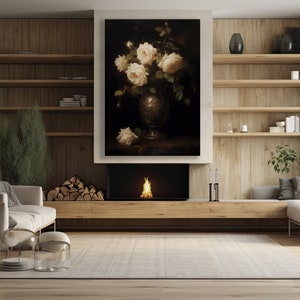May include: A living room interior with a fireplace, a couch, and a painting of white roses in a vase. The painting is hanging above the fireplace.