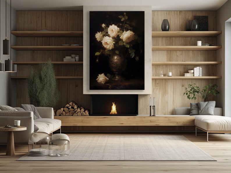 May include: A living room interior with a fireplace, a couch, and a painting of white roses in a vase. The painting is hanging above the fireplace.