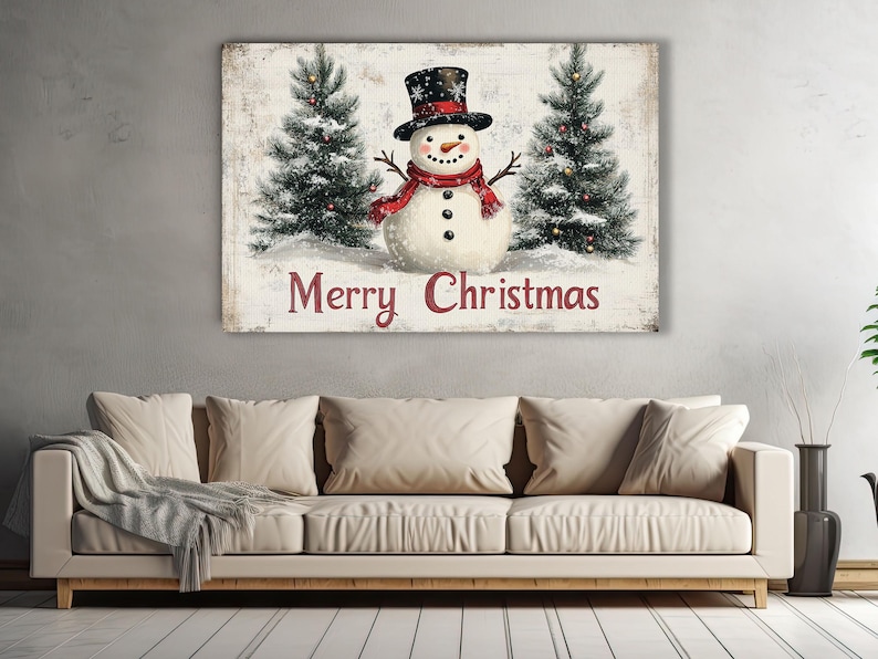 K&ouml;nnte beinhalten: Eine Weihnachtskarte im Vintage-Stil mit einem Schneemann mit rotem Schal und schwarzem Zylinder, der zwischen zwei schneebedeckten Kiefern steht. Die Karte tr&auml;gt den Text "Merry Christmas" in roten Buchstaben.