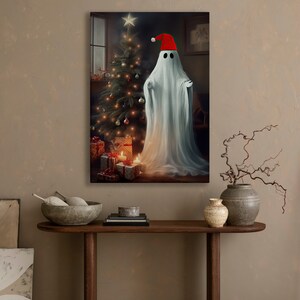 May include: A white ghost wearing a red Santa hat stands in front of a decorated Christmas tree with presents underneath. The ghost is glowing and the room is dimly lit.