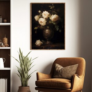 May include: A framed painting of a bouquet of white roses in a silver vase on a dark background.