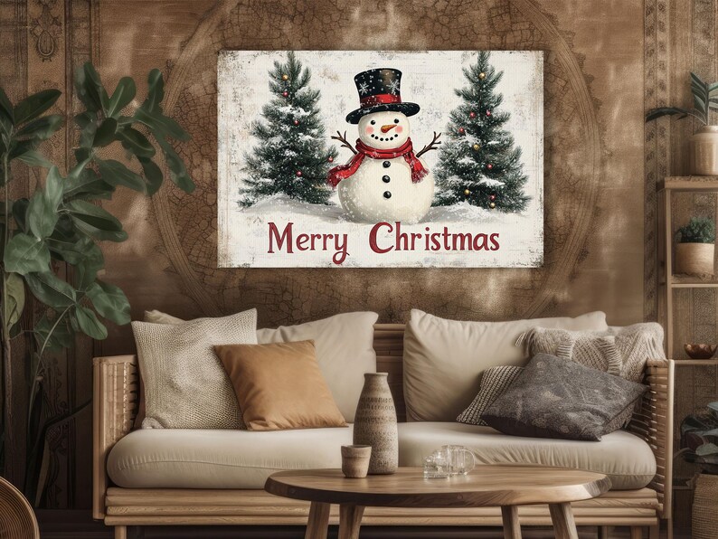 K&ouml;nnte beinhalten: Eine Weihnachtskarte im Vintage-Stil mit einem Schneemann mit rotem Schal und Hut, der zwischen zwei schneebedeckten Kiefern steht. Die Karte tr&auml;gt den Text "Merry Christmas" in roten Buchstaben.