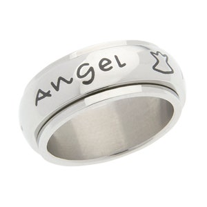 May include: A silver-colored spinner ring with the word "Angel" in black script. An outline of an angel is next to the word. The ring has a smooth, polished finish and a rotating center band.