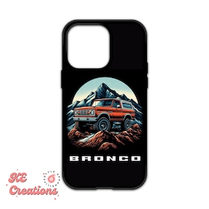 May include: A black phone case with a graphic of a red Ford Bronco driving through a mountain landscape. The text "BRONCO" is printed below the image.