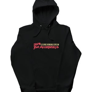 May include: Black hooded sweatshirt with a red graphic print that says "Godzilla" in Japanese and "JBM MOTORSPORTS" in English.