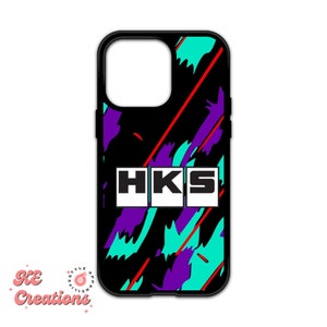 May include: Black phone case with a colorful 90s style graphic design and the text "HKS" in white.