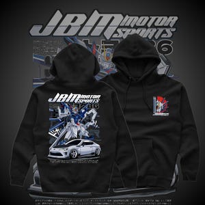 May include: Black hooded sweatshirt featuring a graphic of a white sports car and a robot with the text "JBM MOTOR SPORTS 86". The sweatshirt also has the text "JBM MOTOR SPORTS 6" on the hood.
