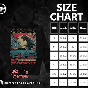 May include: Black hoodie with a graphic print of a Godzilla-like monster attacking a city with a car in the foreground. The text "Legendary Skyline" is printed above the graphic. The text "JBM Motorsports" is printed below the graphic. The text "ICE Creations" is printed below the graphic. The text "Jbmmotorsportsusa" is printed below the graphic. A size chart is shown in the upper right corner of the image. The size chart shows the length, width, and sleeve length in inches for sizes S, M, L, XL, 2XL, and 3XL.