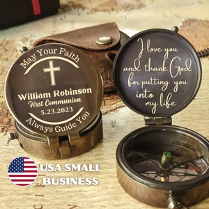 May include: A brass compass with a personalized inscription on the lid. The inscription reads "May Your Faith Always Guide You" and "William Robinson First Communion 5.23.2023". The compass is open and the other side of the lid reads "I love you and thank God for putting you into my life".