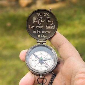 May include: A brass compass with a lid that opens to reveal a message that reads "You are The Best Thing I've ever found on the internet Kayla".