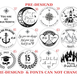 May include: A set of 12 black and white pre-designed round wood ornaments with various designs and text. The designs include a compass, a lighthouse, a mountain range, a graduation cap, a heart, and a Christmas tree. The text includes "You are my true north", "I love you to the moon and back", "So you can always find your way back to me", "You are my anchor", "We still do", "Adventure awaits", "2023", "15 years", "I would be lost without you", and "Merry Christmas!"