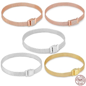 May include: Four mesh bracelets with a clasp closure. The bracelets are available in silver, gold, rose gold, and a two-tone silver and rose gold. Each bracelet has a small square charm with clear cubic zirconia stones.