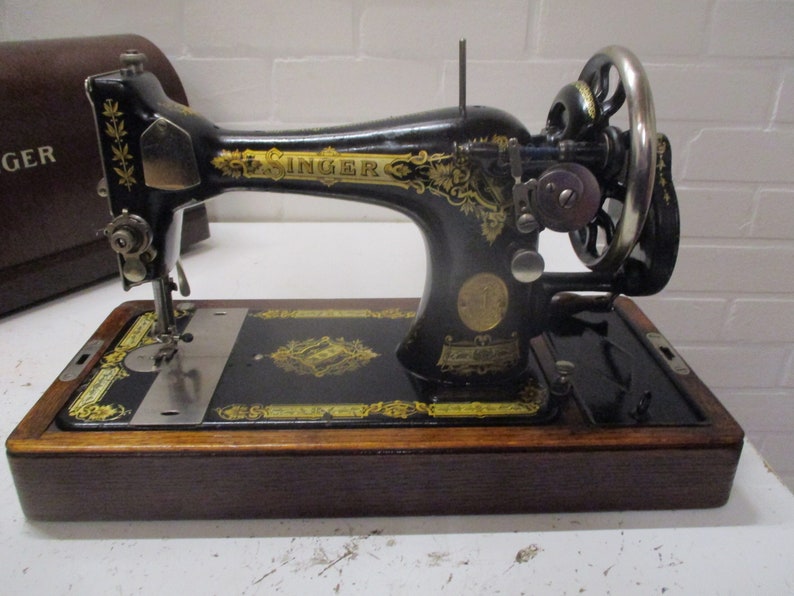 vintage singer sewing machine with hood image 1