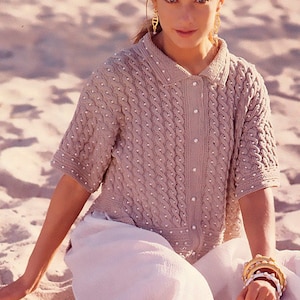 Knitting close fitting garter stitch cardigan with rib top