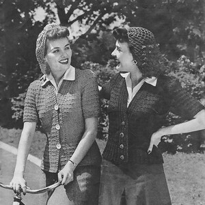 May include: A monochrome image featuring two women in knitted cardigans. One is a short-sleeved style with buttons, the other a V-neck. Both are smiling. Text at the bottom reads "WILLOW YARN LONG TORSO CARDIGAN No. 3813" and "WILLOW YARN V NECK CARDIGAN No. 3814".
