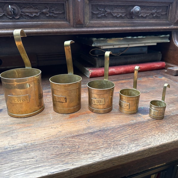 Antique brass measuring cups - a piece of cake - kitchen decoration