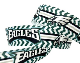 May include: Green and white chevron patterned ribbon with the Philadelphia Eagles logo and the word "Eagles" printed on it.