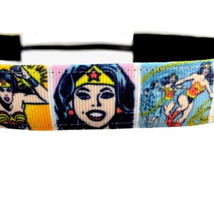 May include: A black headband with a colorful Wonder Woman comic book print. The print features Wonder Woman in various poses and expressions.