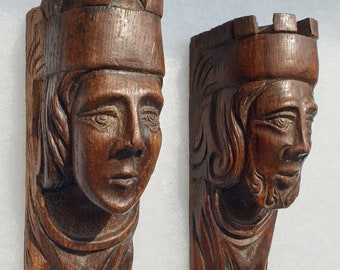 Set of 2 antique heads, oak consoles from the 19th century