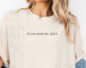 May include: Cream-coloured t-shirt featuring the phrase "if you need me, don't" in black. A light blue denim jacket is worn with the shirt. This is a casual, everyday wear item.
